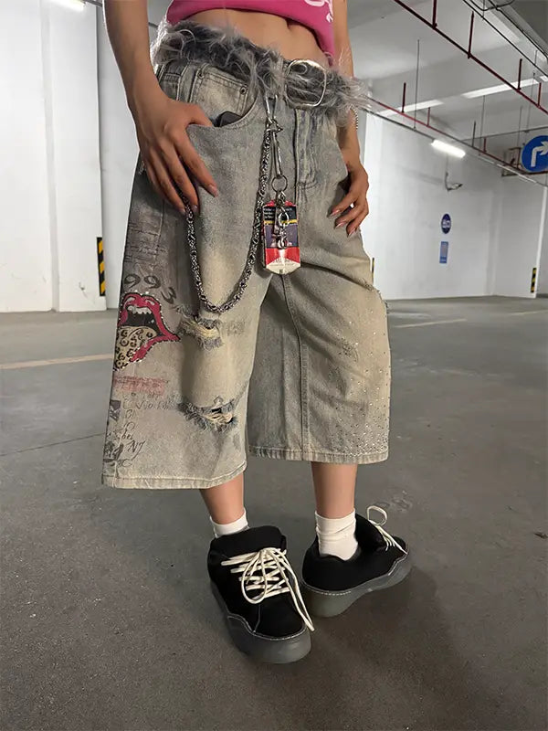 DoubleCrazy Product 579 washed denim jorts styled with a graphic top, red shoes, bag and streetwear accessories
