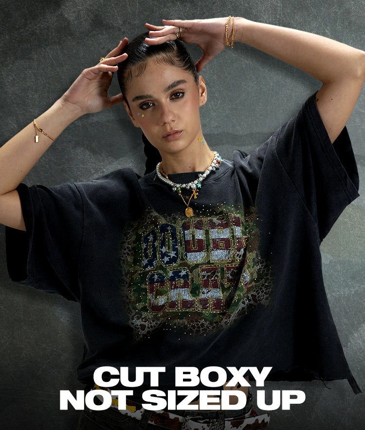 Model wearing a black DoubleCrazy boxy fit graphic tee with wide sleeves, a roomy body and raw cropped hem.