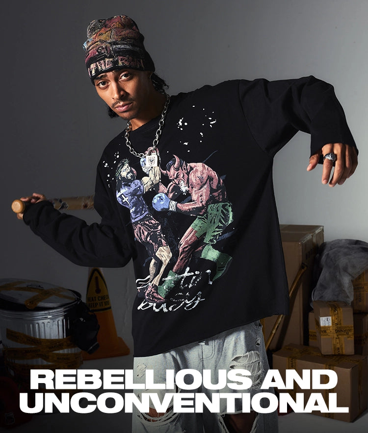 Model wearing a black DoubleCrazy rebellious graphic long-sleeve shirt with distressed artwork in an industrial setting.