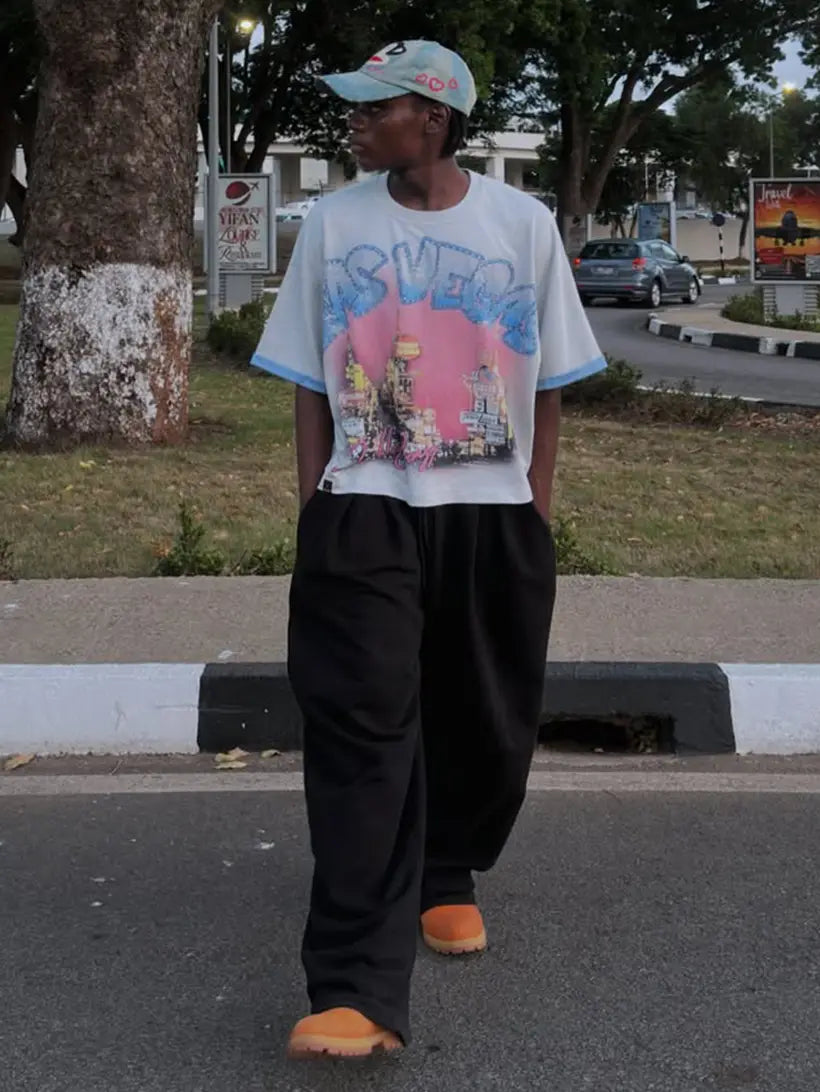 Styling direction: loose trousers, cap, brown boots
